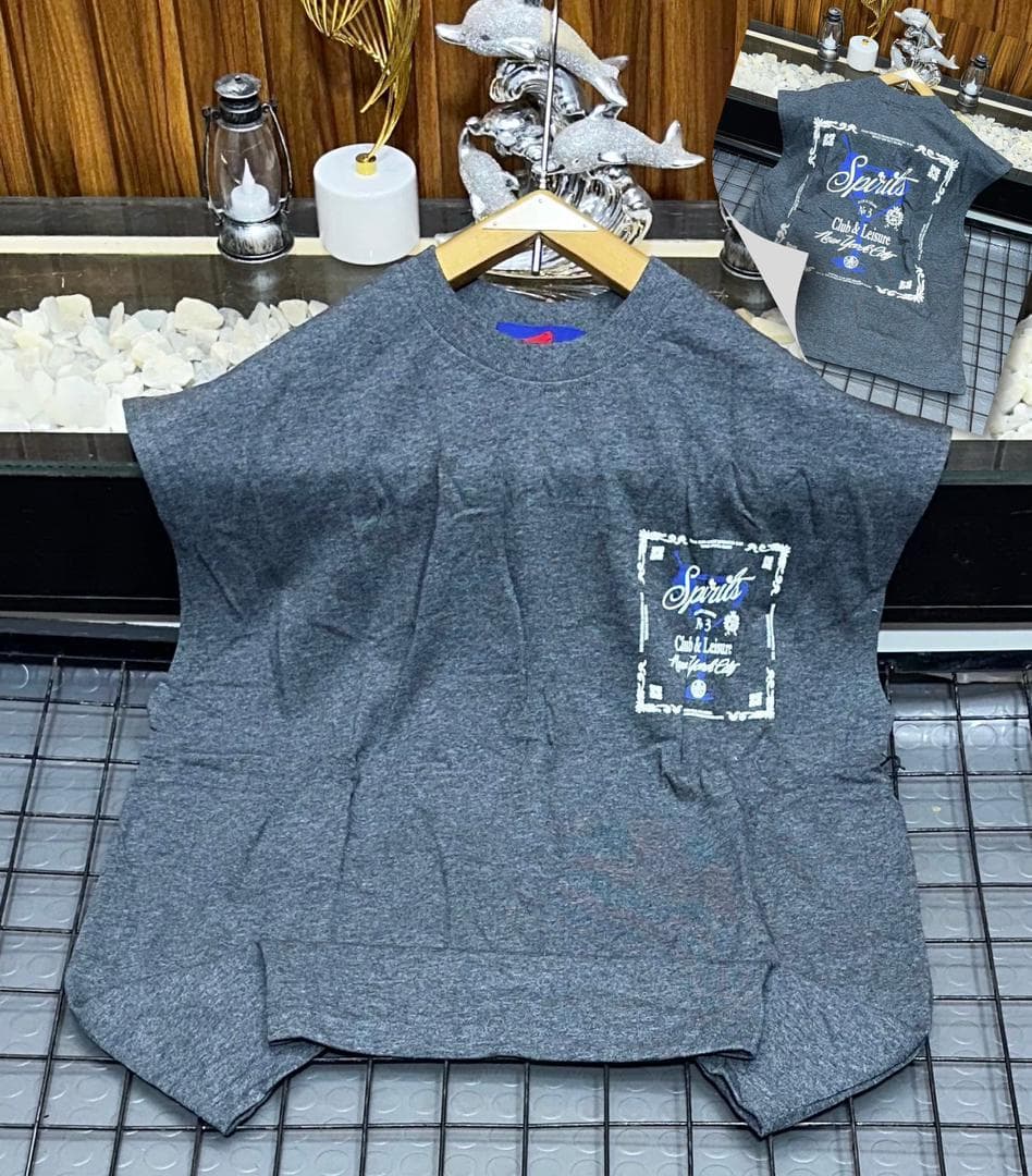 Gray Spirits graphic sleeveless sweatshirt on hanger with back inset.