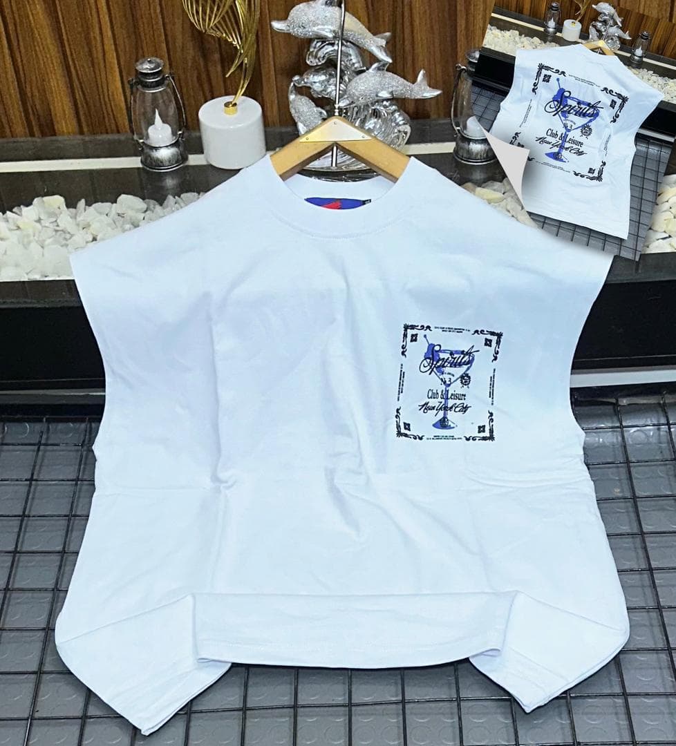 White Spirits graphic sleeveless sweatshirt on hanger with back inset.
