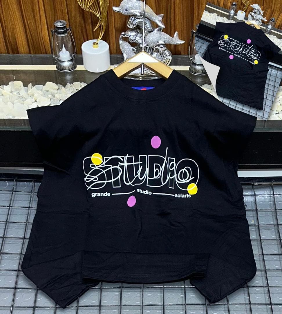 Black Studio graphic sleeveless sweatshirt on hanger with back inset view.