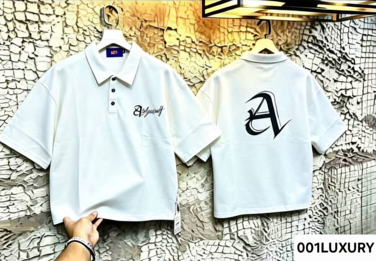 White polo shirt with Askyourself front and large A logo on back.