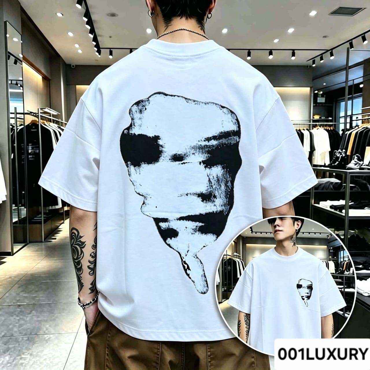 Man viewed from back wearing white oversized t-shirt with large abstract face graphic print.