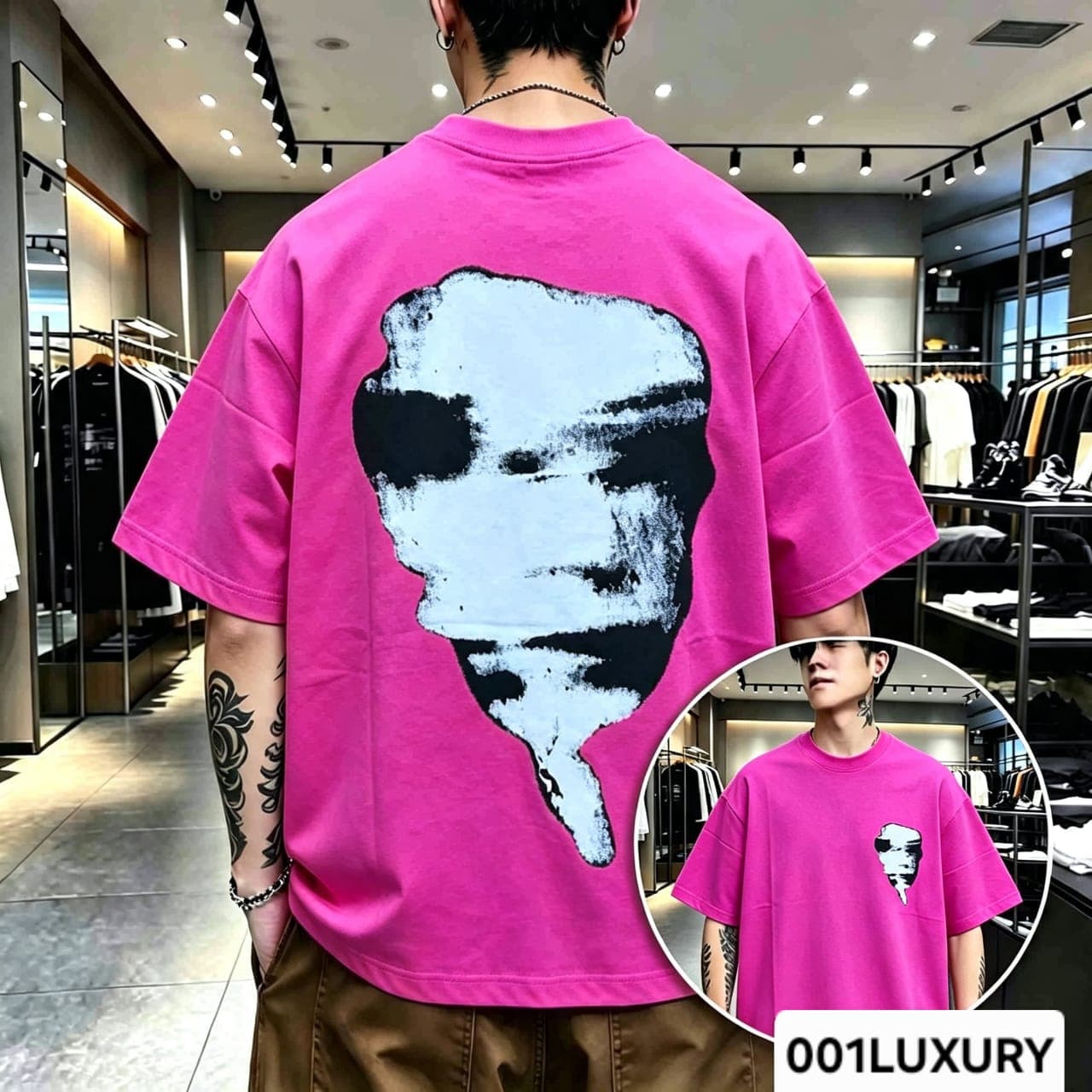 Man viewed from back wearing magenta oversized t-shirt with large abstract face graphic print.