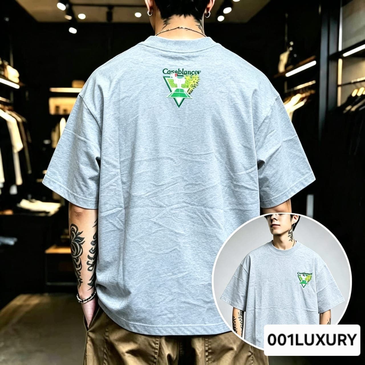 Man viewed from back wearing gray oversized t-shirt with large Casablanca triangular graphic print.