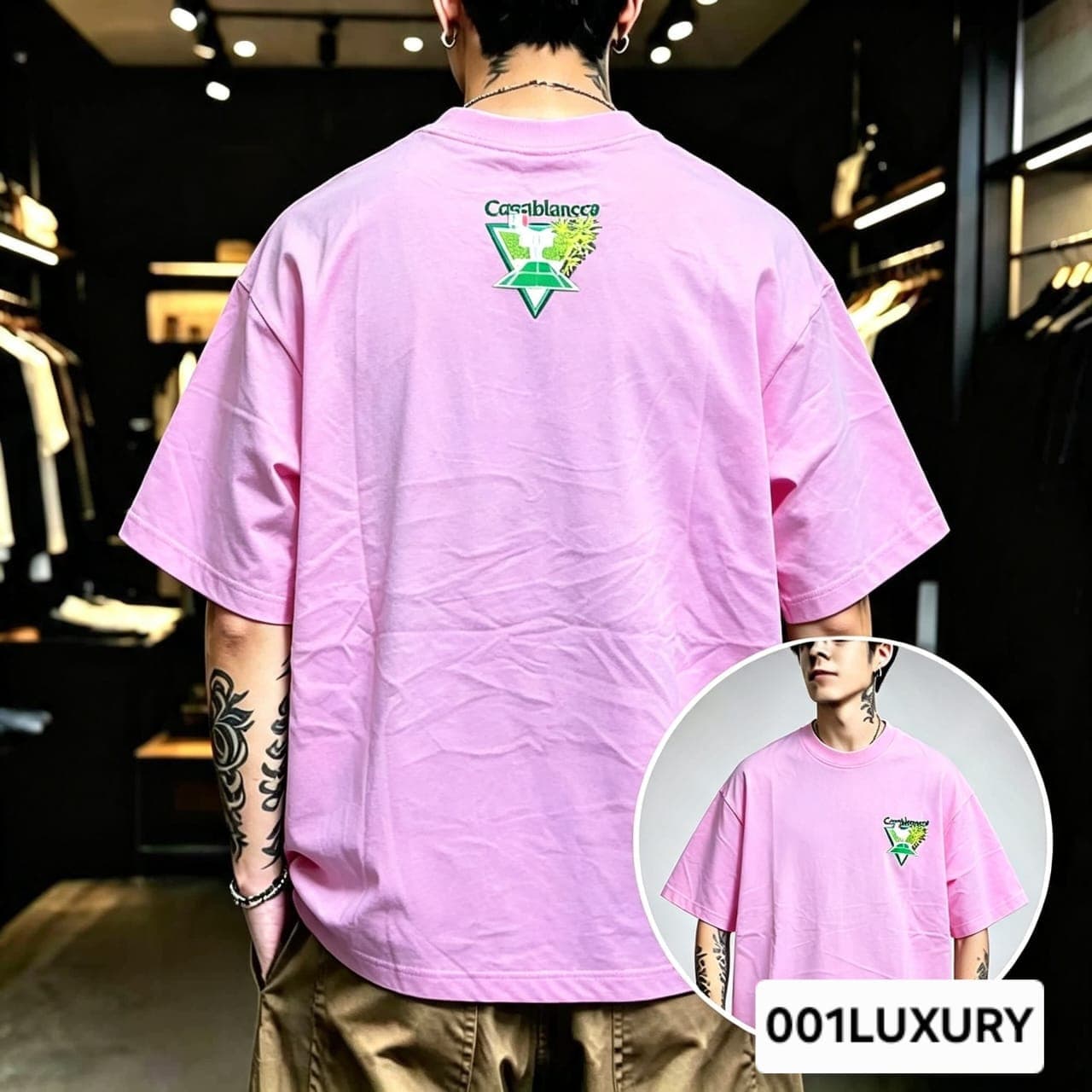 Man viewed from back wearing pink oversized t-shirt with large Casablanca triangular graphic print.