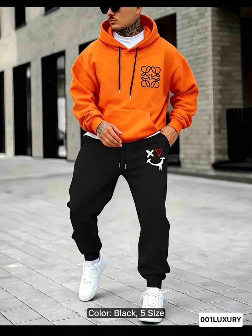 Orange Loewe hoodie on model highlighting chest logo and fit.