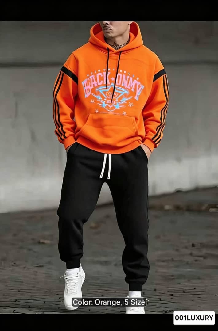 Man wearing orange Back Onmy graphic hoodie with hands in pockets.