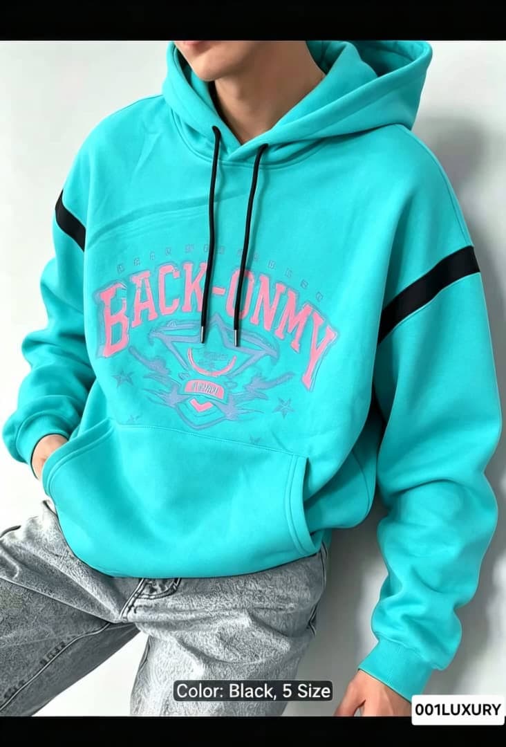 Close-up of turquoise Back Onmy graphic hoodie on model.