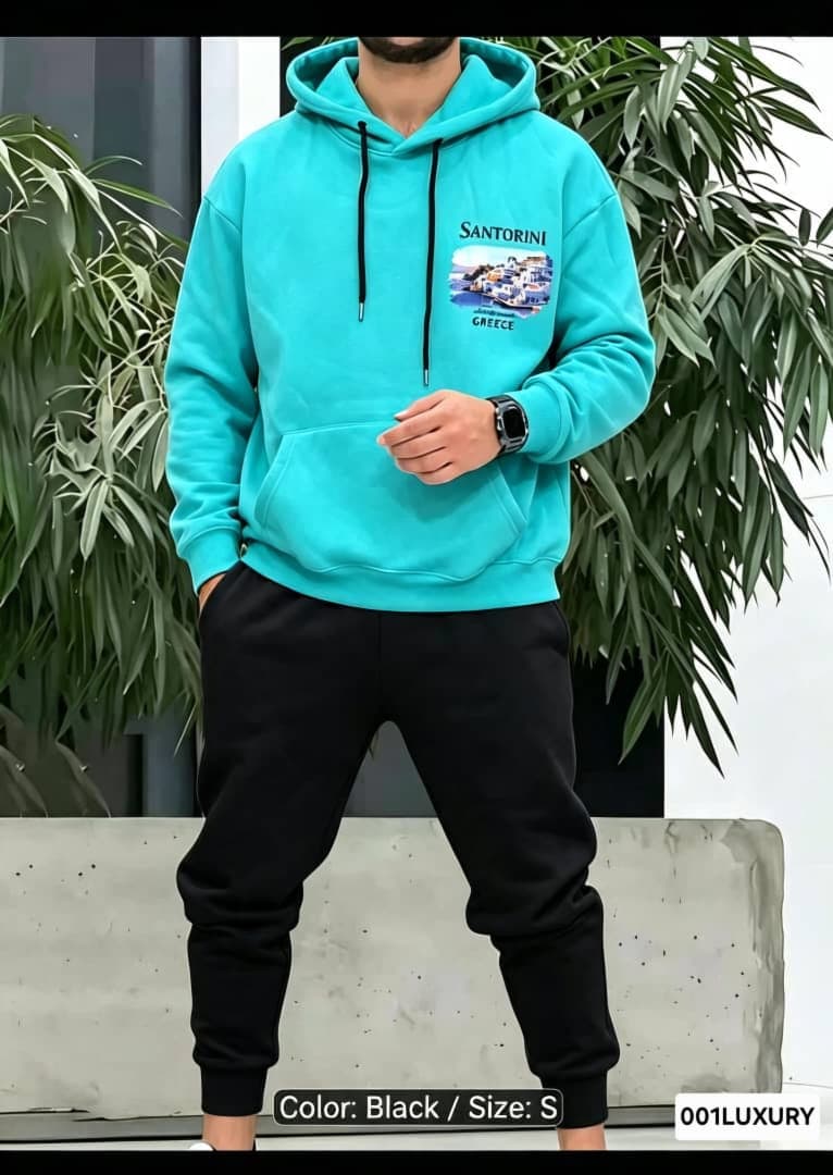 Man wearing turquoise Santorini graphic hoodie with front print visible.
