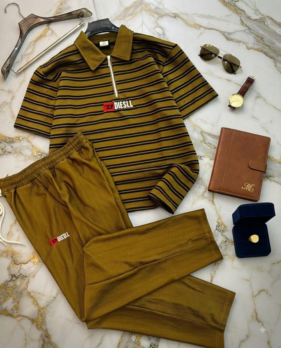 Striped olive and black ribbed quarter-zip top with matching joggers and Diesel logos.