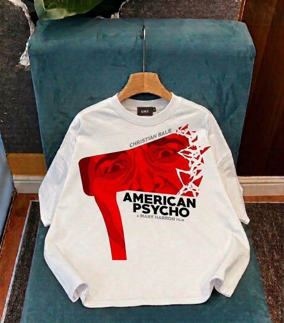 White oversized long sleeve tee with red American Psycho Christian Bale graphic and text.