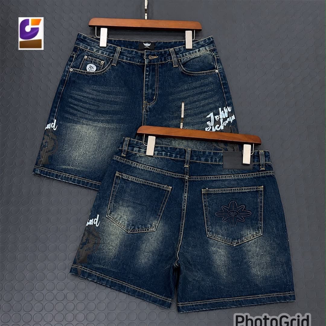 Blue graphic denim shorts shown in front and back views on hangers.