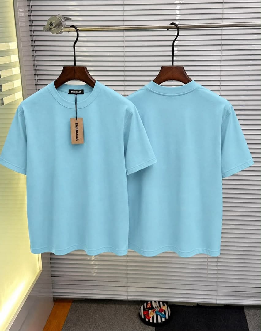 Light blue plain T-shirt shown front and back with tags.