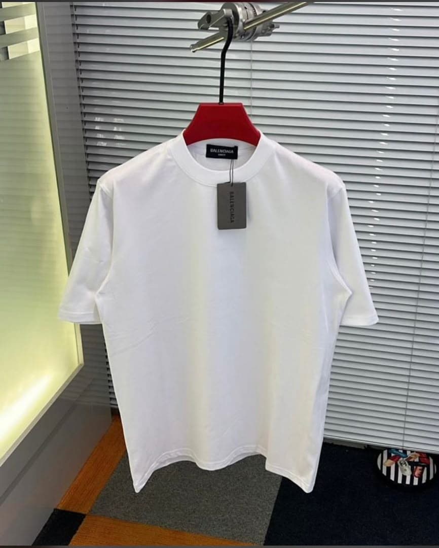 White plain T-shirt with Balenciaga tag on red hanger.