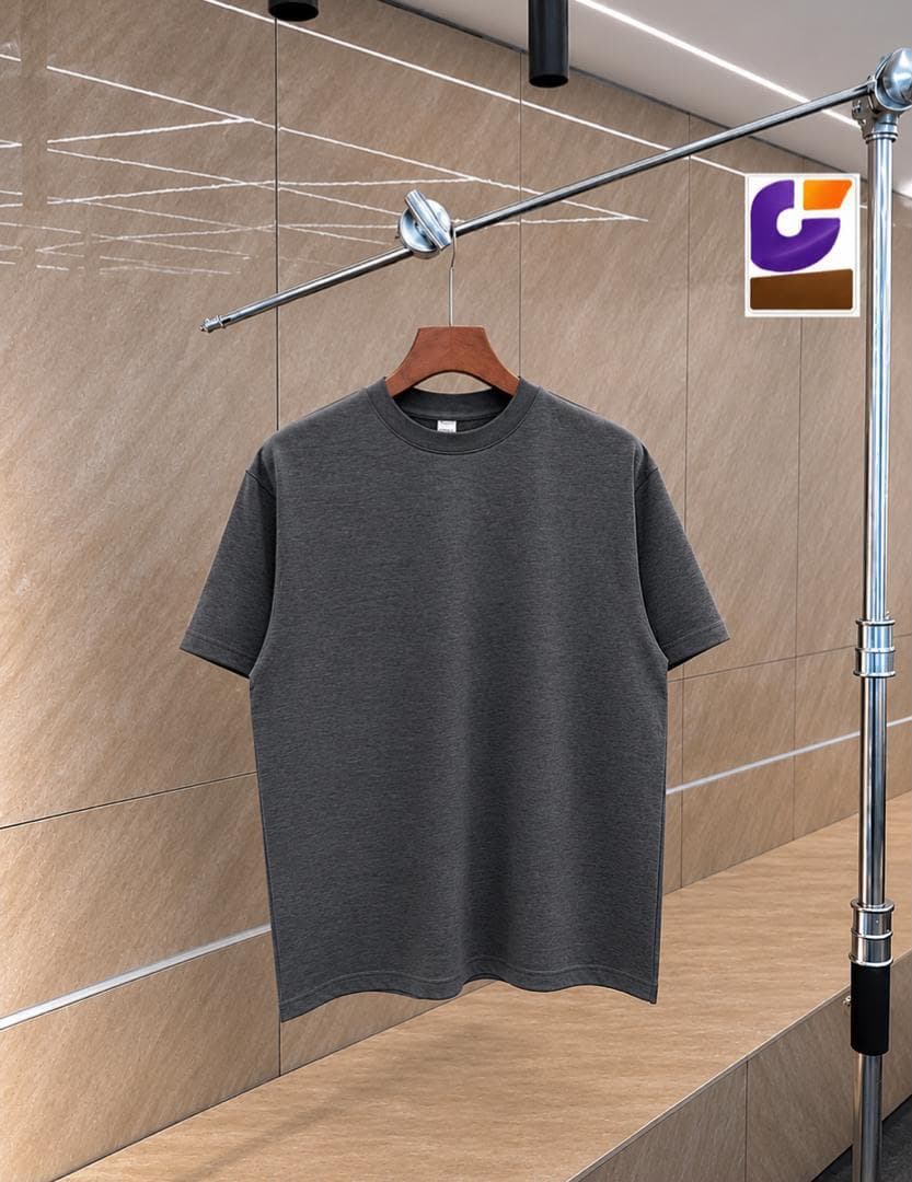 Gray plain oversized T-shirt on wooden hanger.