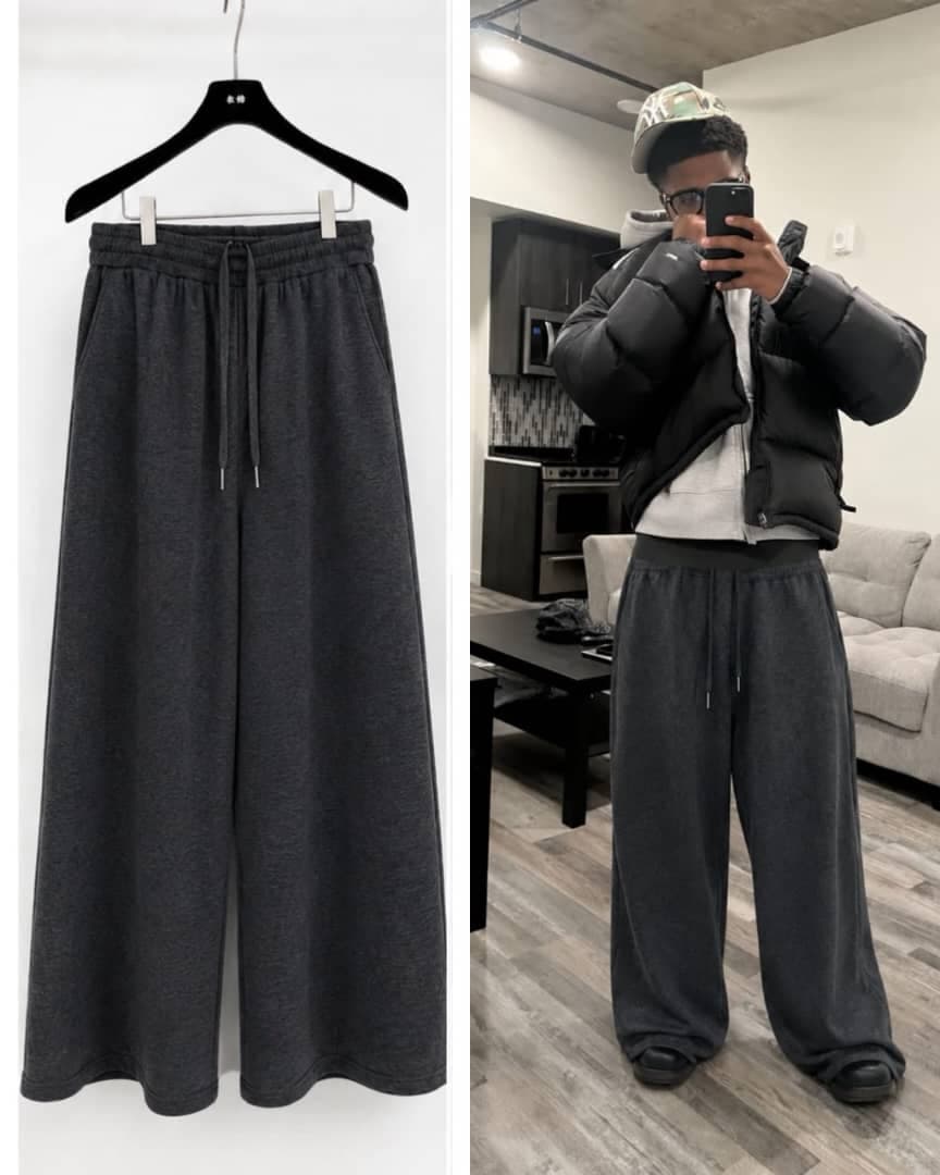 Dark gray flare joggers on hanger and worn by male model indoors.
