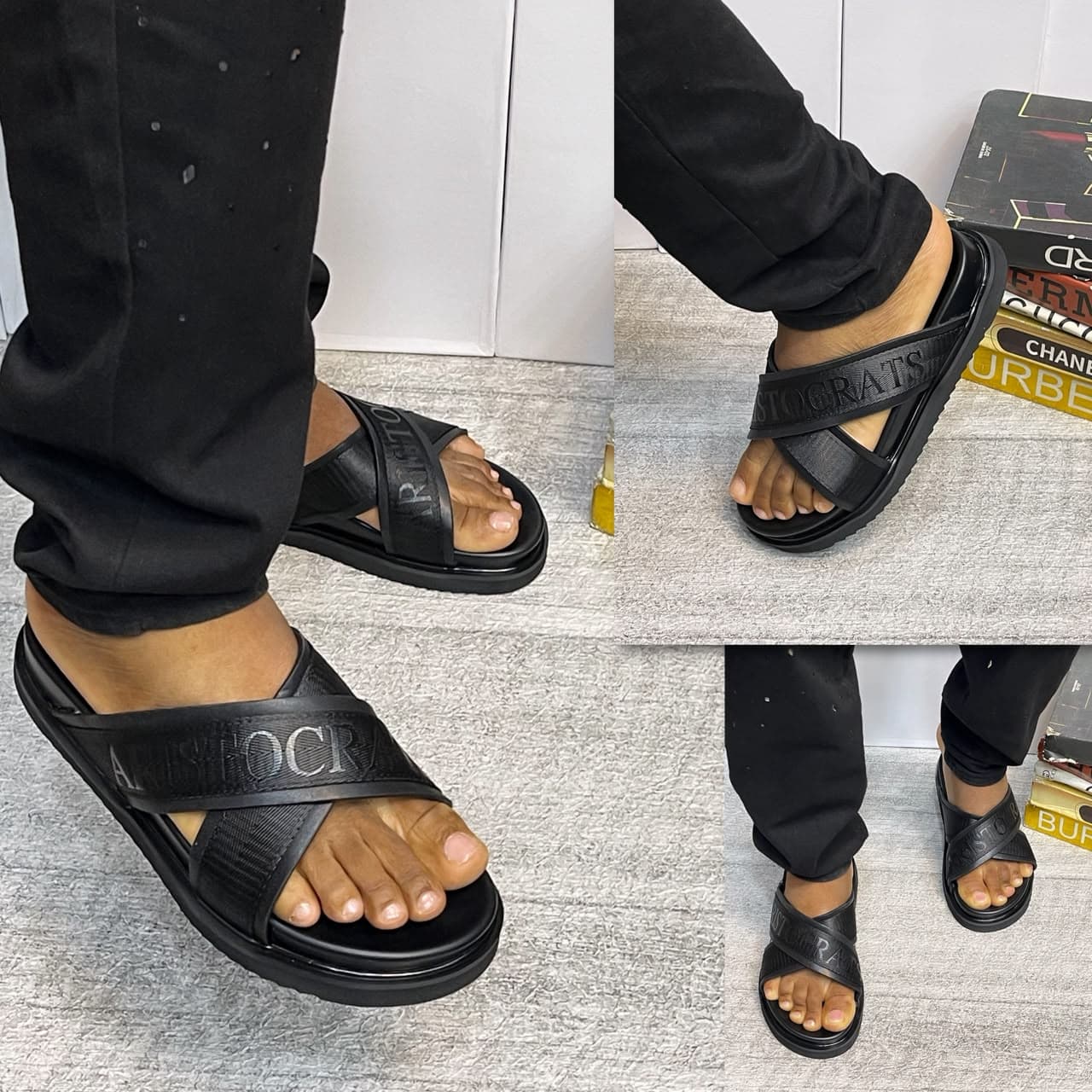 Black Aristocrats Luxury Pams with criss-cross straps and branding on model.