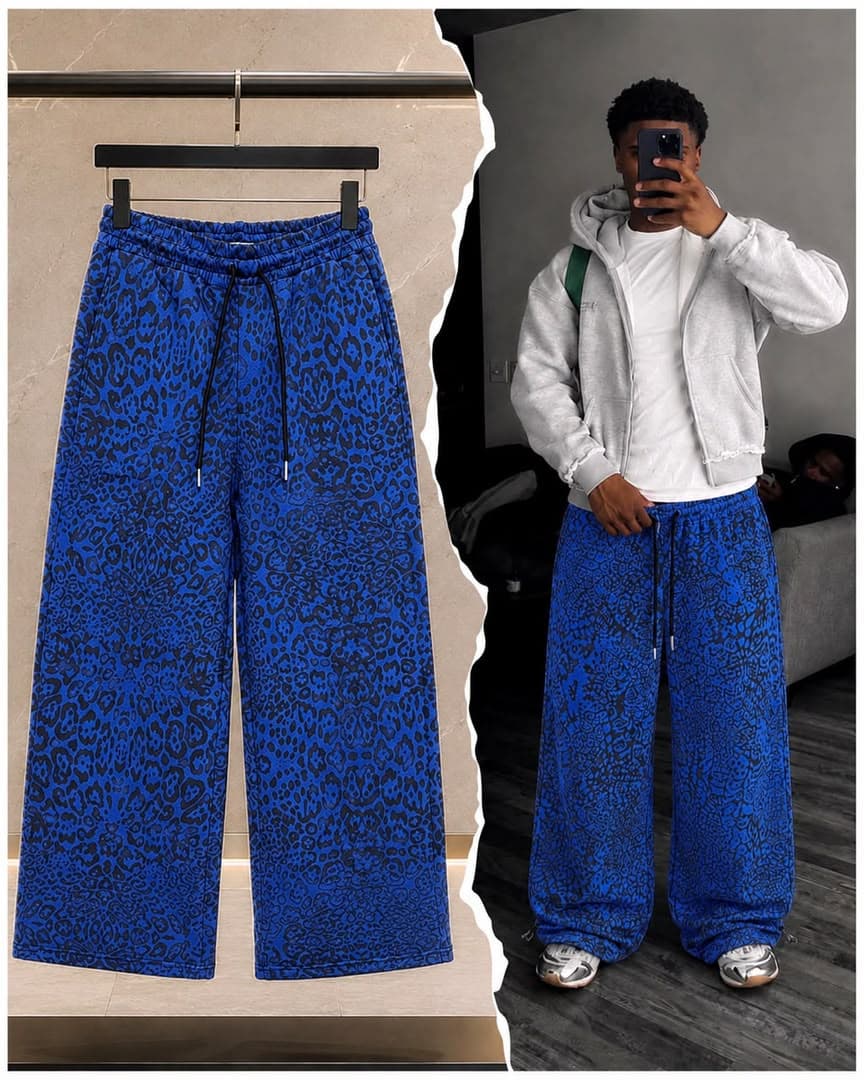 Blue all-over print joggers shown flat on hanger and worn by model.