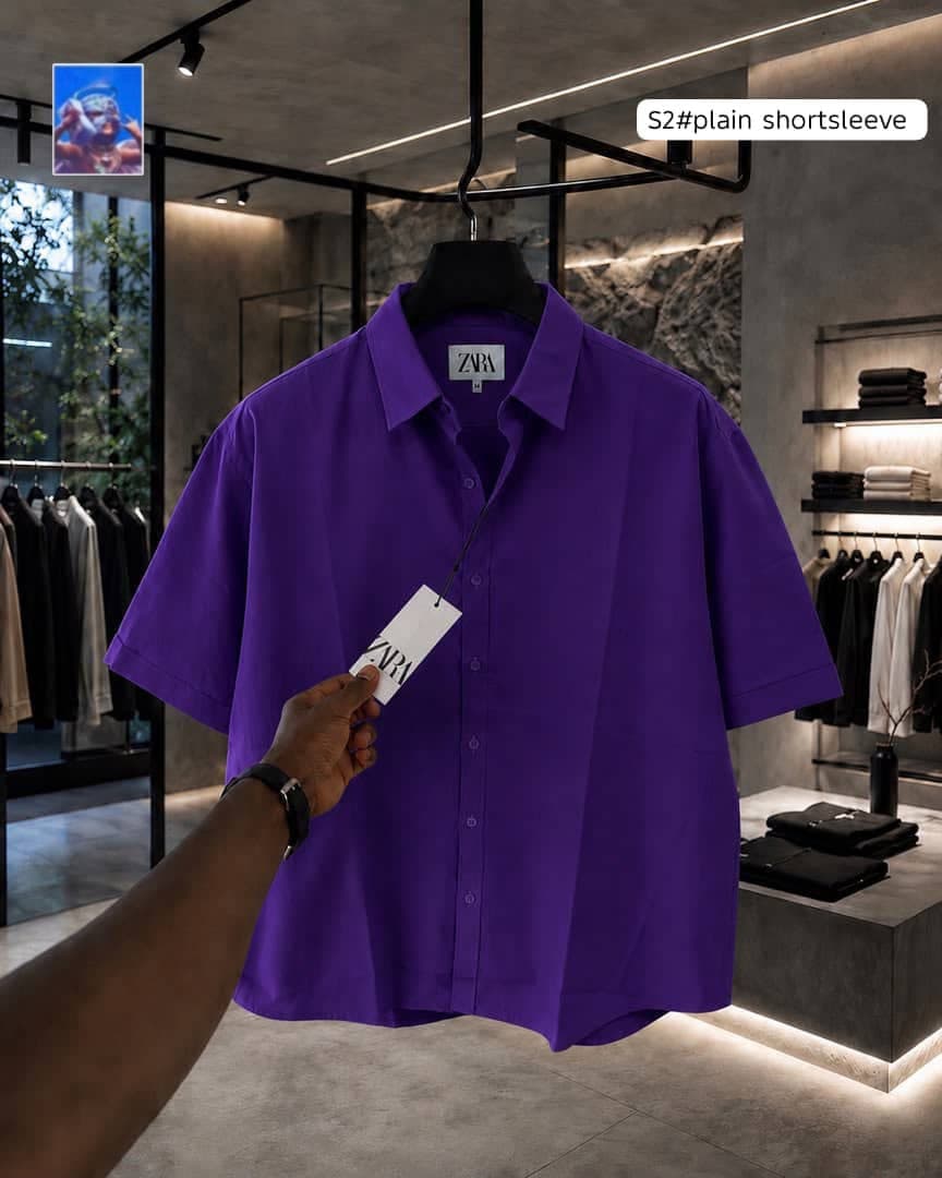 Zara plain short sleeve shirt in purple on hanger.