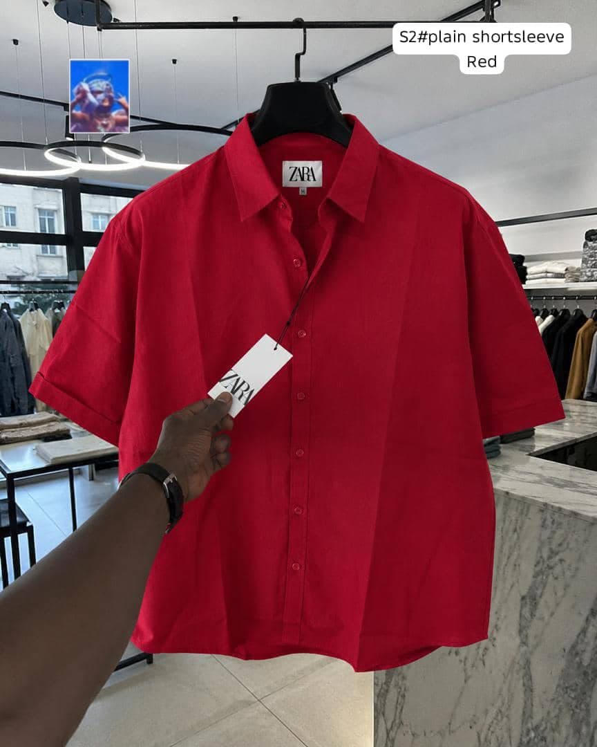 Zara plain short sleeve shirt in red on hanger.