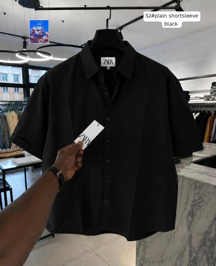 Zara plain short sleeve shirt in black on hanger.