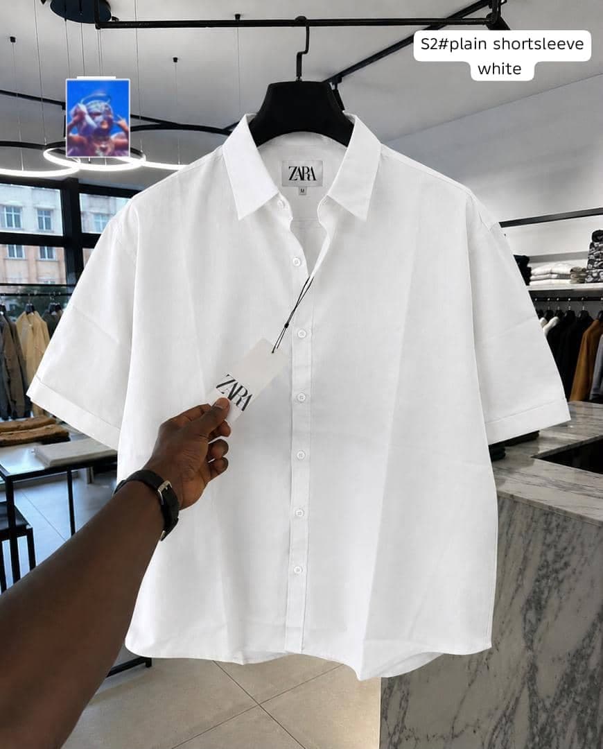 Zara plain short sleeve shirt in white on hanger.