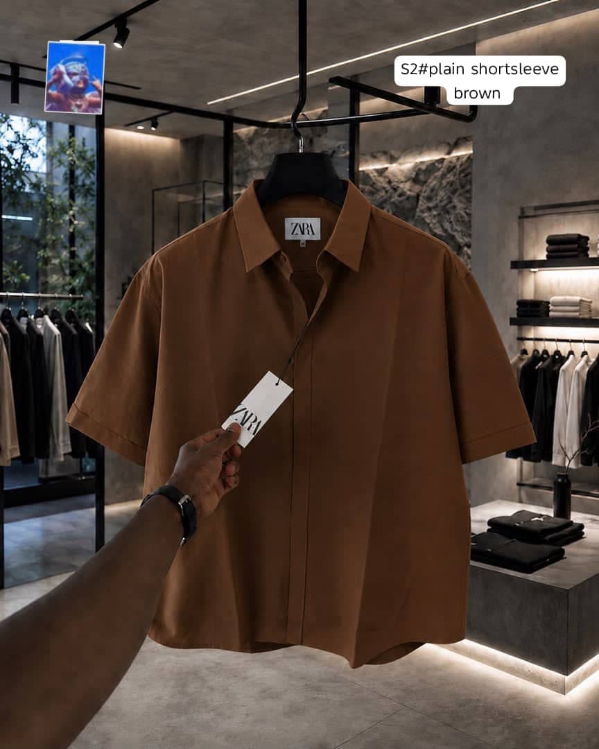 Zara plain short sleeve shirt in brown on hanger.