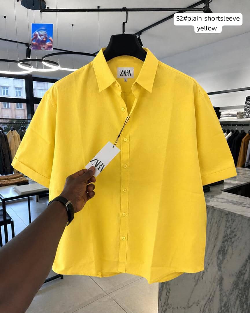 Zara plain short sleeve shirt in yellow on hanger.