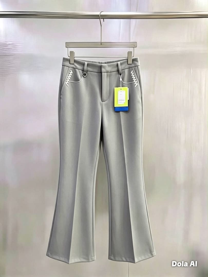 Light gray flare trousers with white zigzag pocket embroidery, hanging view.