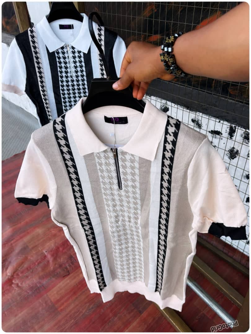 Beige houndstooth knit polo on hanger with black and white version visible in background.