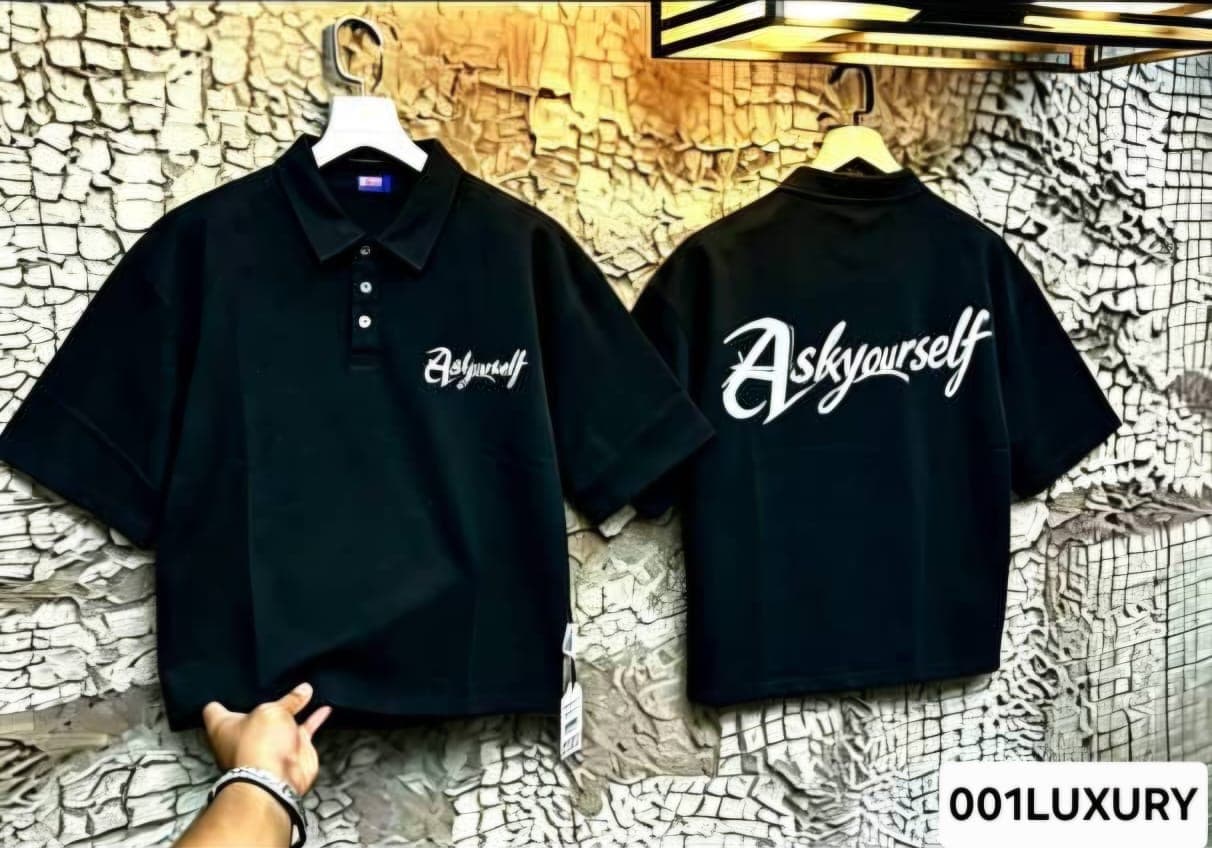 Black polo shirt front and back with Ask Yourself script prints.