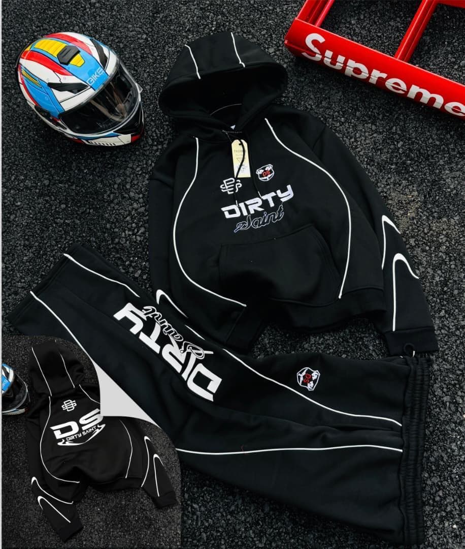 Black Dirty Saint graphic hoodie and joggers two-piece set with helmet and Supreme box.