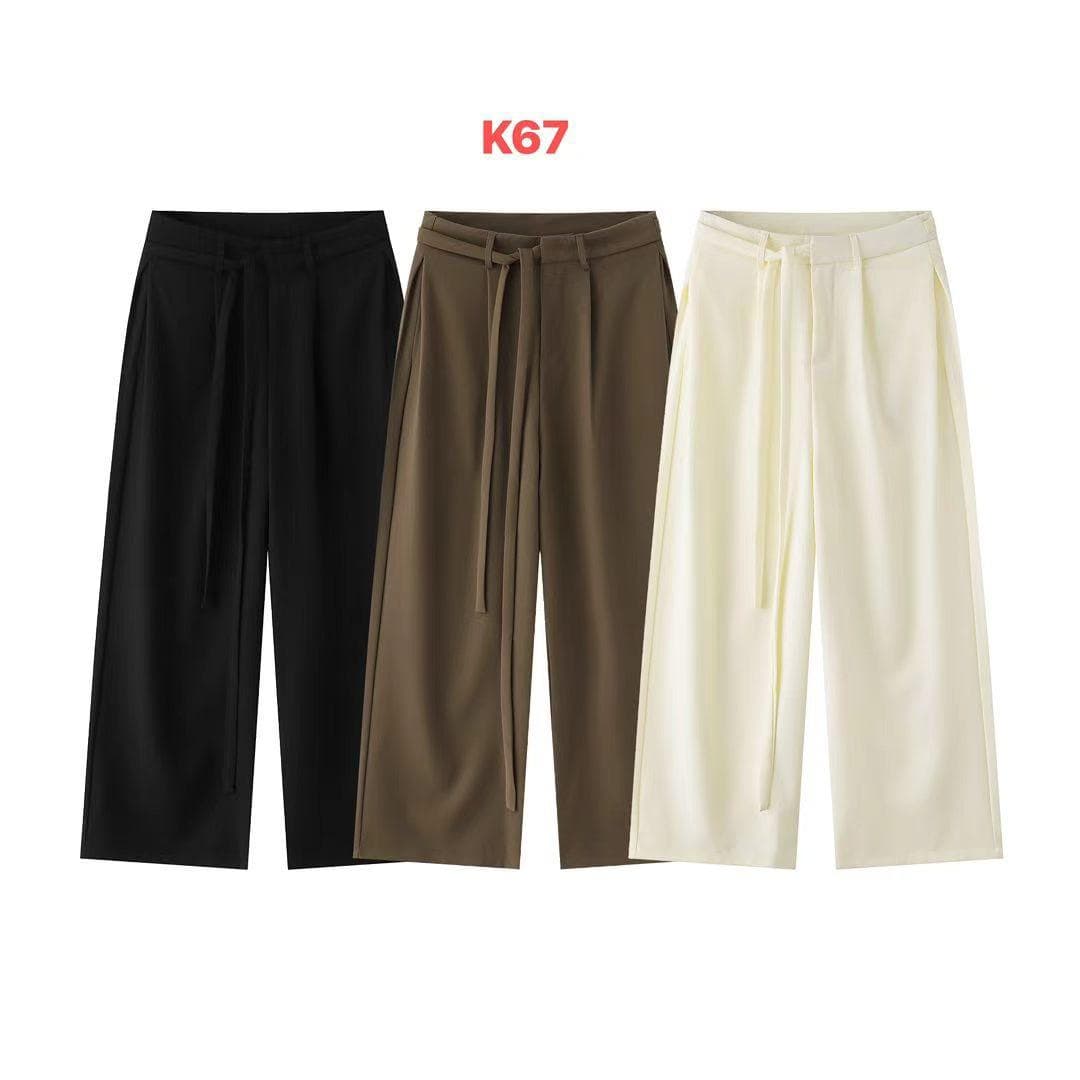Three wide-leg flare trousers in black, olive, and cream with tie waist and pleats.