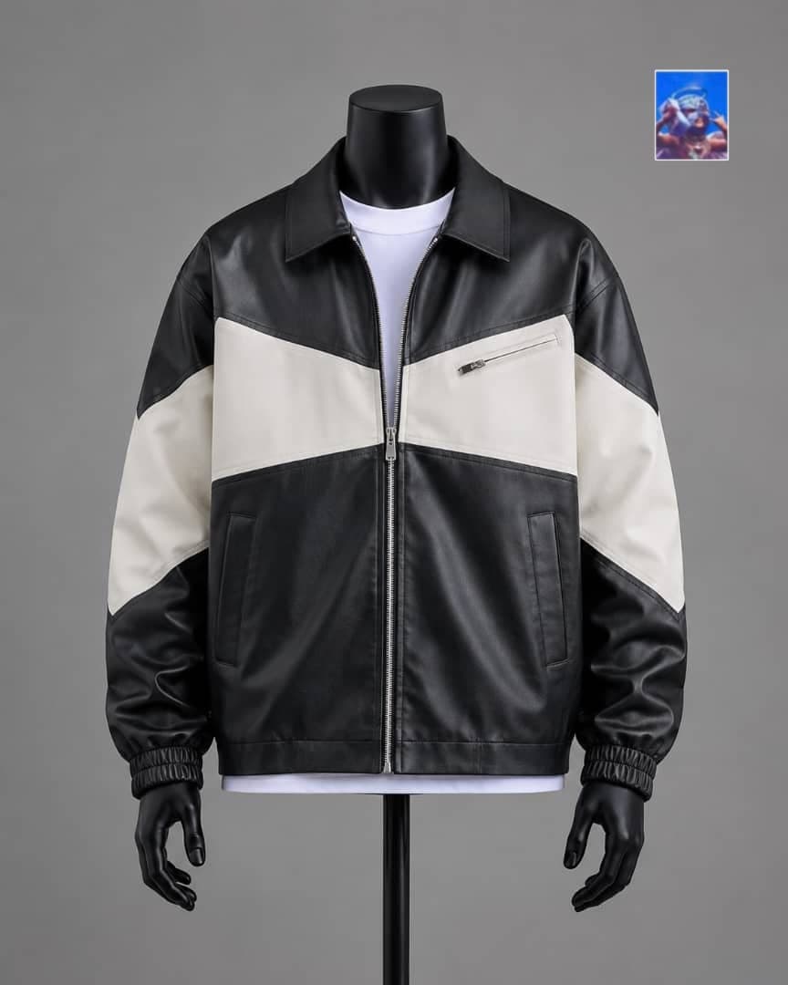 Black and cream colorblock faux leather bomber jacket on mannequin.