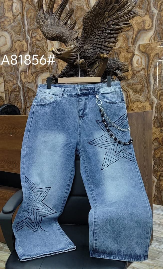 Light blue baggy jeans with black star patterns on legs and black beaded chain.