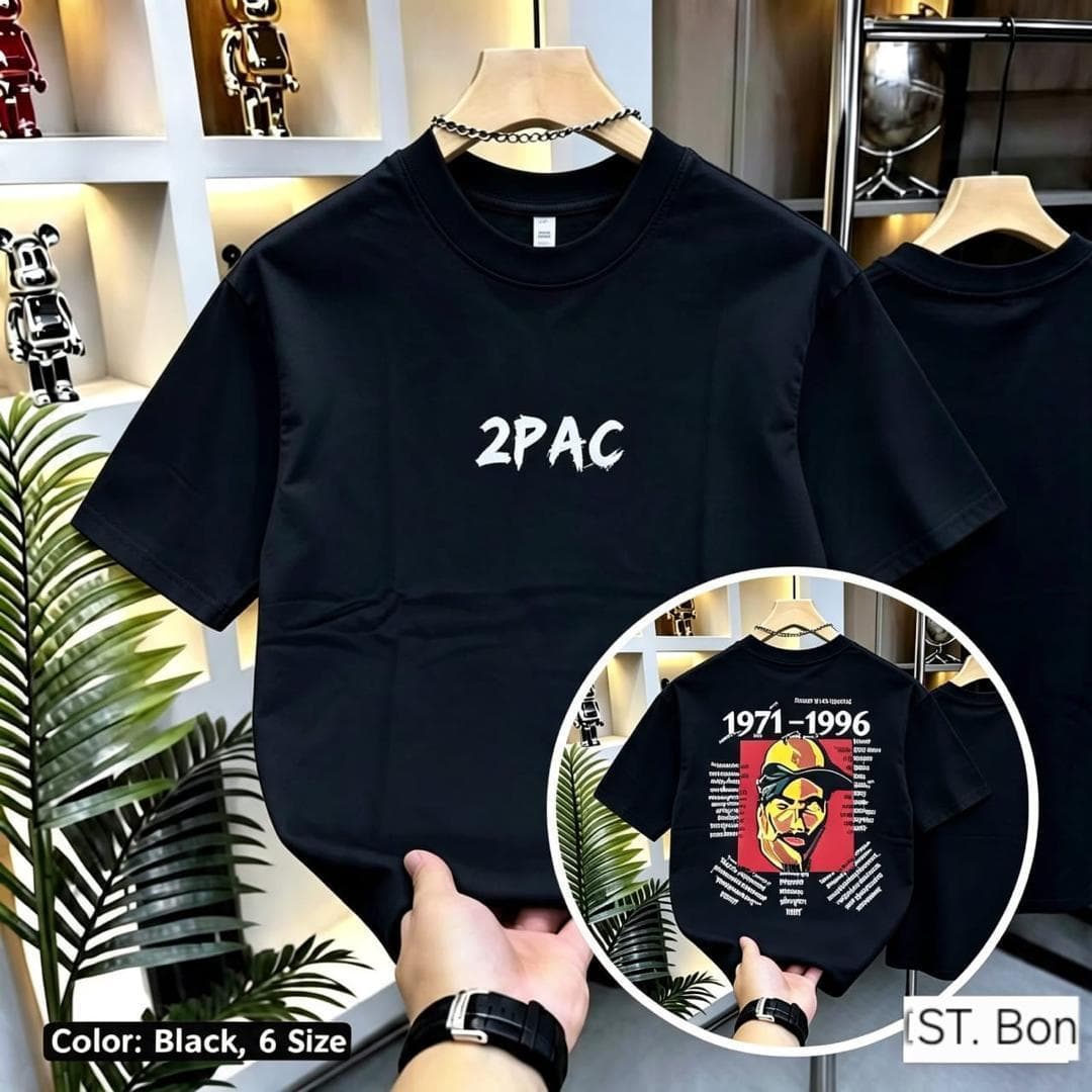 Black 2Pac t-shirt on hanger with front text and circular inset showing back tribute graphic.