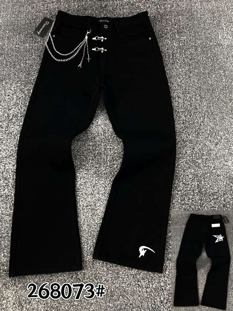 Black lace-up ripped flare jeans hanging next to folded pair with PURPLE tags and G882 label.