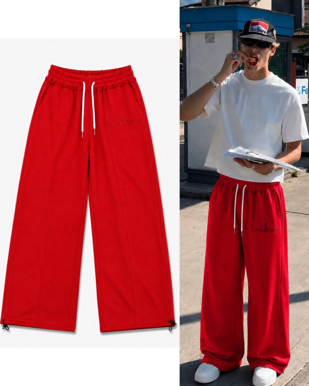 Red Saint Dave joggers shown flat and worn by model outdoors.