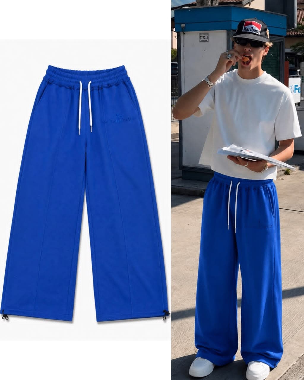 Blue Saint Dave joggers shown flat and worn by model outdoors.