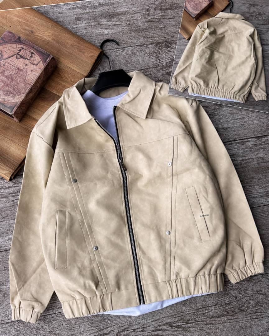 Cream leather bomber jacket with collar on mannequin in studio.