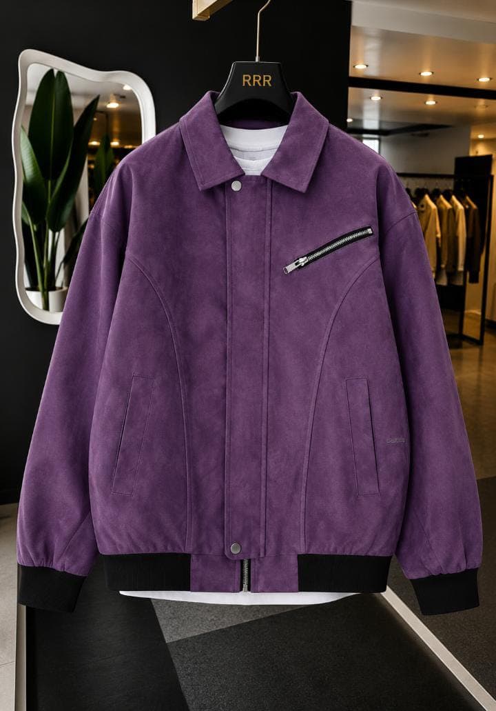 Black leather bomber jacket with buckle collar on mannequin in studio setting.