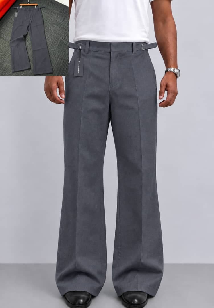 Model wearing gray pleated flare trousers in indoor setting with flat lay inset.