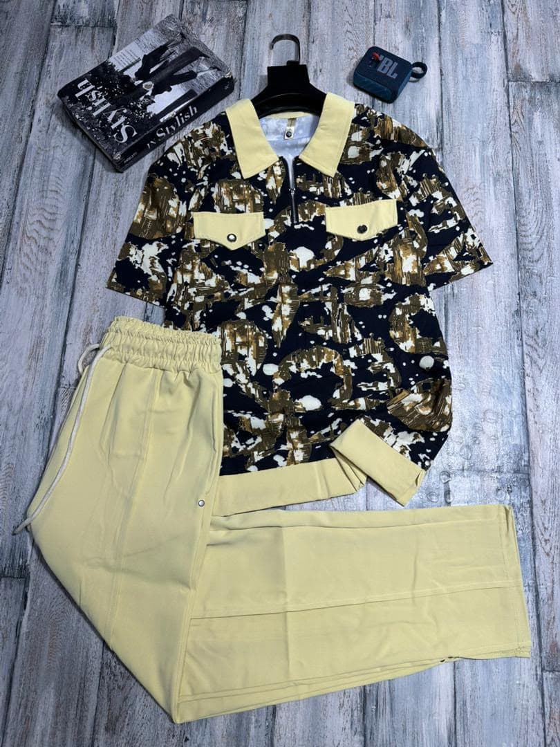 Gold abstract print zip polo shirt with yellow pants two-piece set.