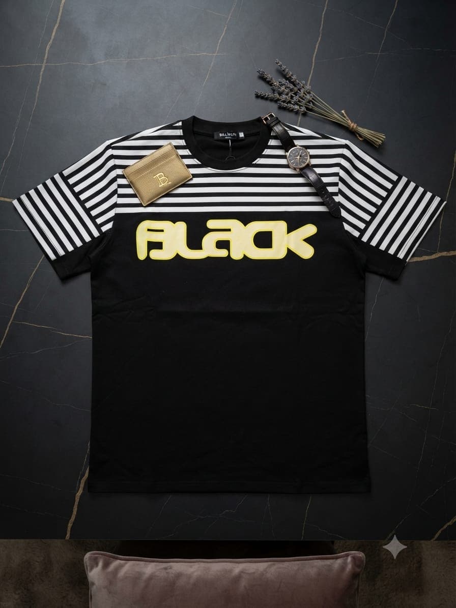 Brown Off White graphic t-shirt on marble table with watch, sunglasses and perfume.