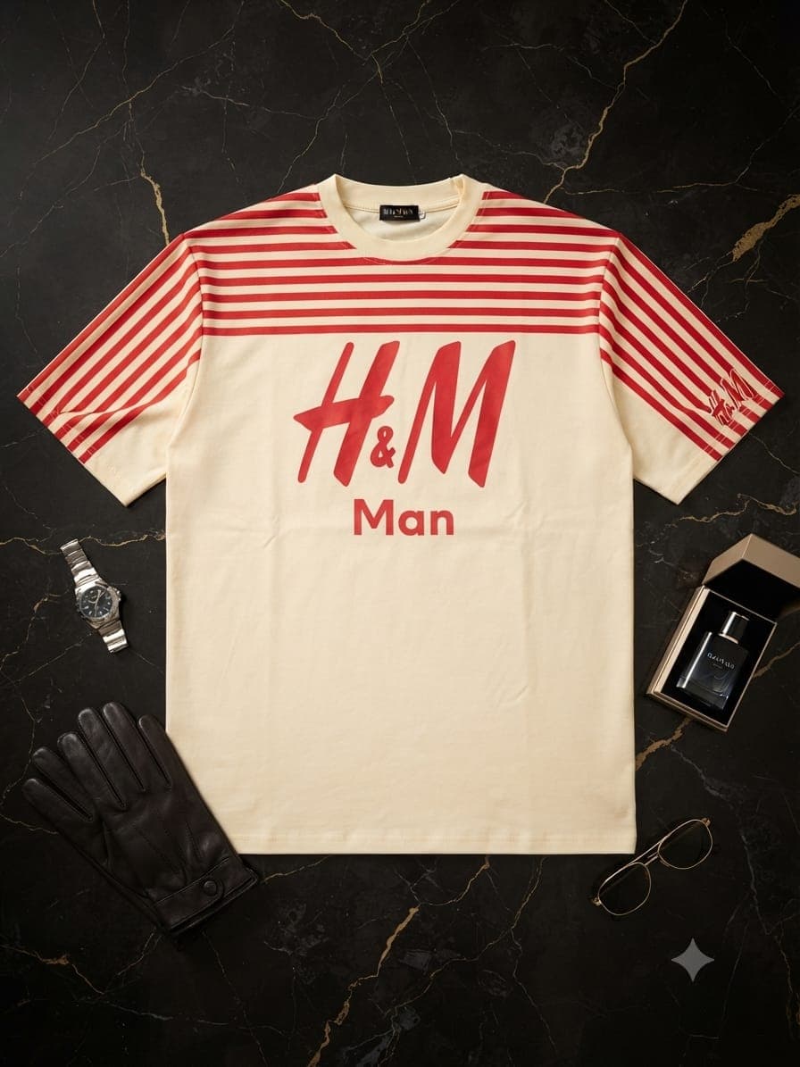 Green Levi's 93 graphic t-shirt folded on marble surface with book and watch.