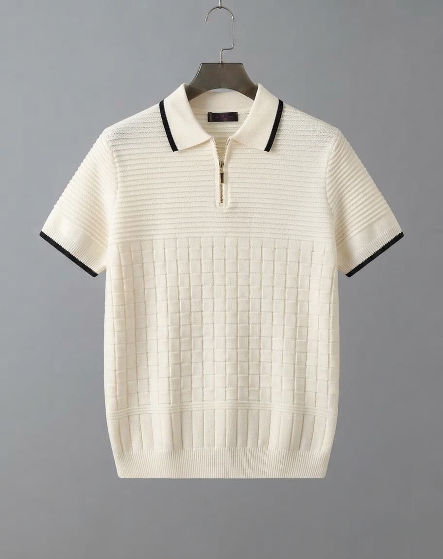 White ribbed knit quarter-zip polo shirt displayed on hanger showing front details.