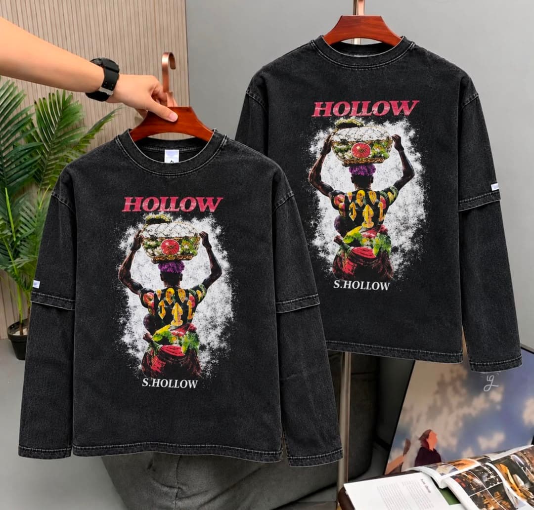 Black stone-washed versions of the Hollow woman carrying basket on head graphic tee.