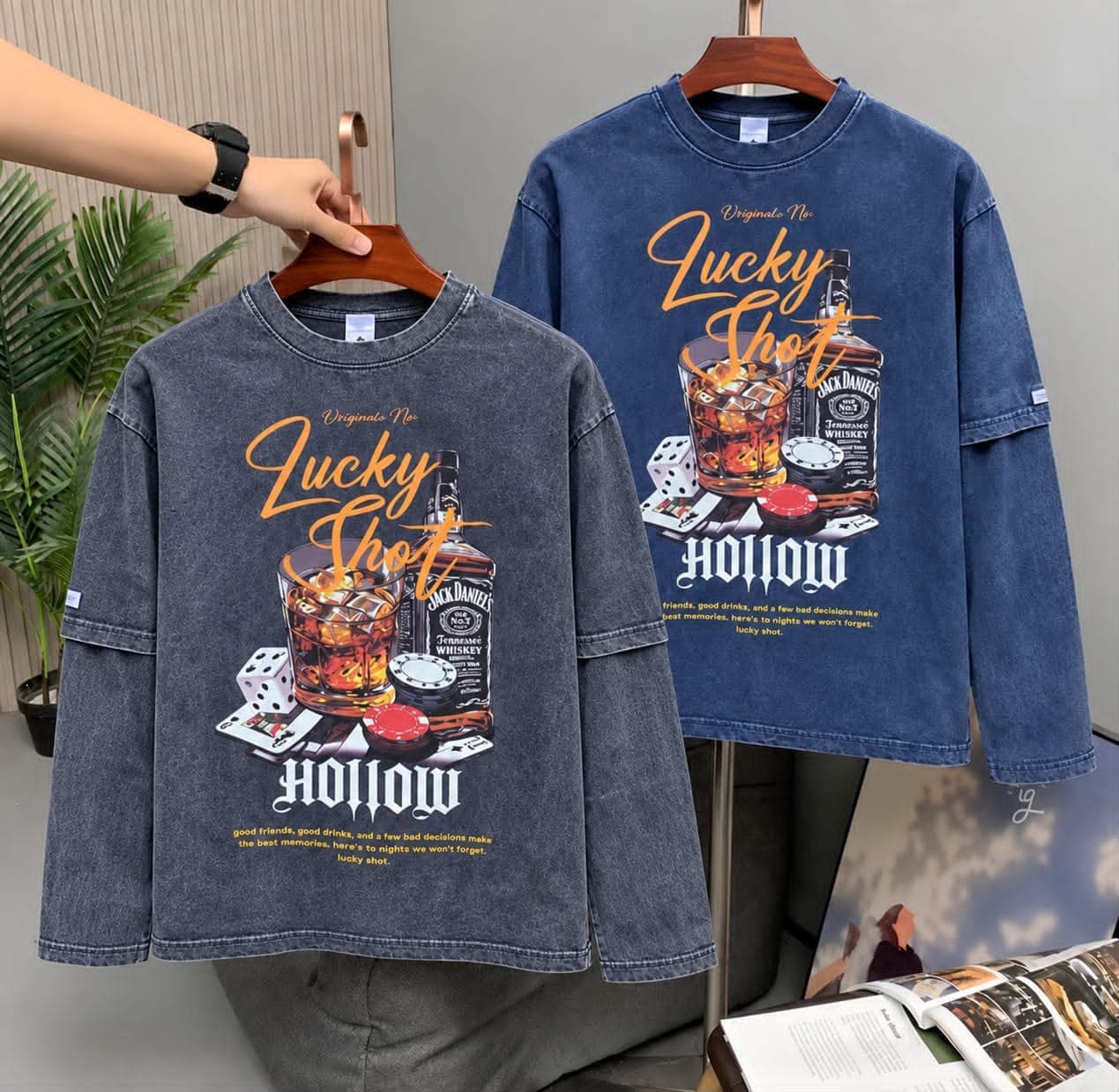 Gray and blue stone-washed tees showcasing the Lucky Shot whiskey, dice, poker and Hollow graphic design.
