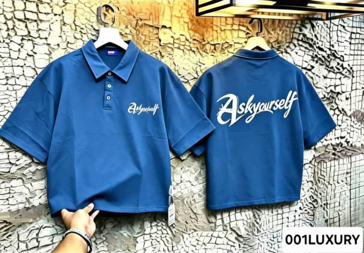 Blue polo shirt displaying Ask Yourself print on front and back.