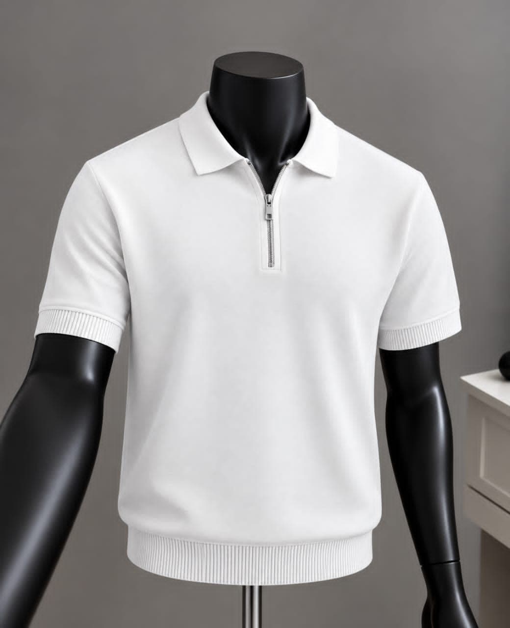 White quarter-zip polo shirt on mannequin with ribbed trims.