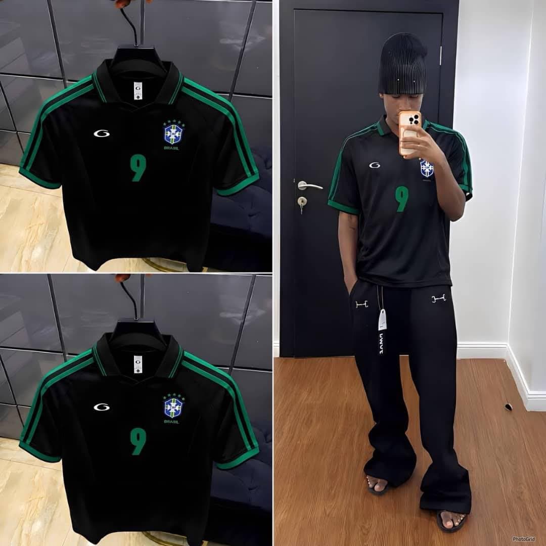Front and back views of the black Brazil #9 polo jersey on hangers.
